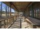 Long wooden front porch with wooden bench and chairs at 1875 Abbie Ln, Jonesboro, GA 30236
