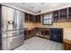 Kitchen with stainless steel refrigerator needing updating at 1875 Abbie Ln, Jonesboro, GA 30236