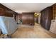 Hardwood floor living room with dark wood walls at 1875 Abbie Ln, Jonesboro, GA 30236