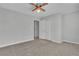 Bedroom with ceiling fan, carpet, and access to bathroom at 3490 Glen Devon Dr, Powder Springs, GA 30127