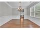 Bright dining room with hardwood floors and chandelier at 3490 Glen Devon Dr, Powder Springs, GA 30127