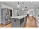 Kitchen island with stainless steel appliances and white cabinets at 3490 Glen Devon Dr, Powder Springs, GA 30127