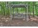 Relaxing pergola with swing in a wooded area at 3490 Glen Devon Dr, Powder Springs, GA 30127