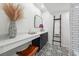 Chic bathroom with unique tile flooring, granite counters and modern fixtures at 6851 Roswell Rd # N-20, Sandy Springs, GA 30328