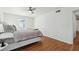 Main bedroom featuring hardwood floors, ceiling fan, and ensuite access at 6851 Roswell Rd # N-20, Sandy Springs, GA 30328