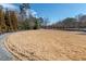 Large grass area with tall trees and a swing set in the distance at 6851 Roswell Rd # N-20, Sandy Springs, GA 30328