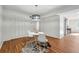 Bright dining area featuring a white table and chairs, and wood floors at 6851 Roswell Rd # N-20, Sandy Springs, GA 30328