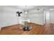 Dining area featuring hardwood floors, modern light fixture, and a closet for storage at 6851 Roswell Rd # N-20, Sandy Springs, GA 30328