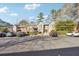 Exterior view of condo buildings with ample parking on a sunny day at 6851 Roswell Rd # N-20, Sandy Springs, GA 30328
