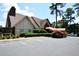 Building exterior with parking and landscaping at 6851 Roswell Rd # N-20, Sandy Springs, GA 30328