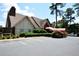 Exterior view of home showing covered entrance and parking lot at 6851 Roswell Rd # N-20, Sandy Springs, GA 30328