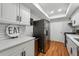 Modern kitchen with white cabinets, quartz countertops, and stainless steel appliances at 6851 Roswell Rd # N-20, Sandy Springs, GA 30328