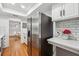 Updated kitchen with stainless steel refrigerator, granite countertops, and subway tile backsplash at 6851 Roswell Rd # N-20, Sandy Springs, GA 30328