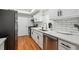 Updated kitchen featuring white cabinets, stainless steel appliances, granite countertops, and white subway tile backsplash at 6851 Roswell Rd # N-20, Sandy Springs, GA 30328