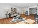 Sunlit living room featuring a comfy couch and a cowhide rug at 6851 Roswell Rd # N-20, Sandy Springs, GA 30328