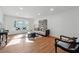 Living room with hardwood floors, bay window, and modern decor at 6851 Roswell Rd # N-20, Sandy Springs, GA 30328