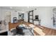 Bright living room with hardwood floors, a stylish sofa, and a barn door at 6851 Roswell Rd # N-20, Sandy Springs, GA 30328