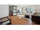 Spacious living room with wood floors, large windows, and stylish decor at 6851 Roswell Rd # N-20, Sandy Springs, GA 30328