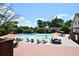 Community pool with lounge chairs and umbrellas at 6851 Roswell Rd # N-20, Sandy Springs, GA 30328