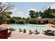 Large community pool with lounge chairs and shade umbrellas at 6851 Roswell Rd # N-20, Sandy Springs, GA 30328