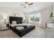 Main bedroom with plush carpet and a luxurious upholstered bed at 147 Stanchion Dr, Union City, GA 30291