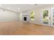 Living room with fireplace and wood-look flooring at 8663 Cedar Creek Rdg, Riverdale, GA 30274