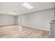 Finished basement with light grey walls and wood-look flooring at 9776 Spyglass Dr, Villa Rica, GA 30180