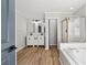 Elegant bathroom with double vanity, soaking tub, and glass shower at 9776 Spyglass Dr, Villa Rica, GA 30180