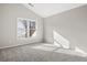 Bright bedroom with grey carpet and large window at 9776 Spyglass Dr, Villa Rica, GA 30180