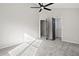 Bedroom with grey carpet, ceiling fan and closet at 9776 Spyglass Dr, Villa Rica, GA 30180