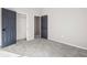 Spacious bedroom with grey carpet and double doors to closet at 9776 Spyglass Dr, Villa Rica, GA 30180