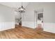 Formal dining room with hardwood floors, wainscoting, and chandelier at 9776 Spyglass Dr, Villa Rica, GA 30180