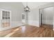 Formal dining room with hardwood floors, wainscoting, and chandelier at 9776 Spyglass Dr, Villa Rica, GA 30180