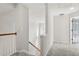 Upstairs hallway with gray carpet and access to other rooms at 9776 Spyglass Dr, Villa Rica, GA 30180