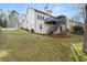 Back exterior of house showing deck and stairs leading to the backyard at 9776 Spyglass Dr, Villa Rica, GA 30180