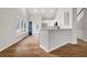 Open concept kitchen with island, hardwood floors, and a breakfast area at 9776 Spyglass Dr, Villa Rica, GA 30180
