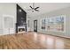 Spacious living room with hardwood floors, fireplace, and built-in shelving at 9776 Spyglass Dr, Villa Rica, GA 30180