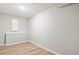 Finished basement storage room with light grey walls and vinyl flooring at 9776 Spyglass Dr, Villa Rica, GA 30180
