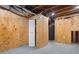 Unfinished basement area with plywood walls and exposed utilities at 9776 Spyglass Dr, Villa Rica, GA 30180