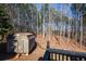 Wooded backyard with storage shed and deck at 202 Greentree Trl, Temple, GA 30179