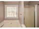 Bathroom featuring garden tub and shower at 202 Greentree Trl, Temple, GA 30179