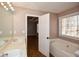 Bathroom boasts double vanity and garden tub at 202 Greentree Trl, Temple, GA 30179