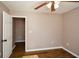 Spacious bedroom with wood flooring and ceiling fan at 202 Greentree Trl, Temple, GA 30179