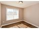 Bedroom with window and wood-look flooring at 202 Greentree Trl, Temple, GA 30179