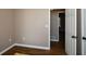 Simple bedroom with wood-look flooring and door at 202 Greentree Trl, Temple, GA 30179