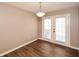 Dining room with hardwood floors and French doors leading to a patio at 202 Greentree Trl, Temple, GA 30179