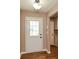 Light and bright entryway with hardwood floors and access to kitchen at 202 Greentree Trl, Temple, GA 30179