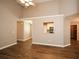 Living room with hardwood floors, a kitchen pass-through and vaulted ceiling at 202 Greentree Trl, Temple, GA 30179