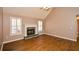 Living room with hardwood floors, a fireplace, and vaulted ceiling at 202 Greentree Trl, Temple, GA 30179