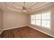 Main bedroom with hardwood floors, large window, and tray ceiling at 202 Greentree Trl, Temple, GA 30179